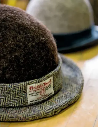  ??  ?? A finished bowler-style hat, with its felt top and Harris Tweed brim.