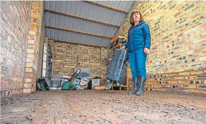  ?? Picture: Steve MacDougall. ?? Craigie resident Patricia Duncan alongside some of the damaged contents of her lock-up on Balmoral Place, Perth.
