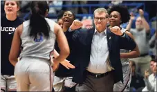  ?? Jessica Hill / Associated Press ?? Coach Geno Auriemma and the UConn Huskies will open the season at No. 3 in the AP Top 25 poll.