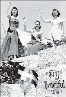  ??  ?? THE COMMERCIAL APPEAL FILES Flanked by her alternates, Miss Jane Rhyan Ivy (center), Miss City Beautiful, rode her float down Main Street on April 13, 1951, in the parade which officially opened Memphis Clean-Up, Paint Up, Fix Up Week. Miss Ivy, of...