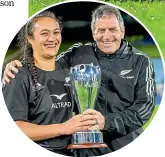  ?? PHOTOSPORT ?? Black Ferns captain Ruahei Demant and coach Wayne Smith with the Pacific Four Series trophy after beating the United States 50-6 on Saturday.