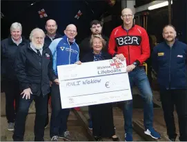  ??  ?? Mick Nolan and Paul O’Connor presenting a cheque for €350 to Wicklow RNLI on behalf of Wicklow Triathlon Club.