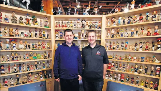  ?? [CARRIE ANTLFINGER/AP PHOTOS] ?? Brad Novak, left, and Phil Sklar, co-founders of the National Bobblehead Hall of Fame and Museum in Milwaukee
