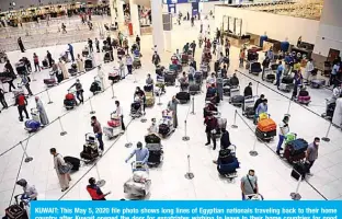  ?? —Photo by Yasser Al-Zayyat ?? KUWAIT: This May 5, 2020 file photo shows long lines of Egyptian nationals traveling back to their home country after Kuwait opened the door for expatriate­s wishing to leave to their home countries for good during the aviation closure period.