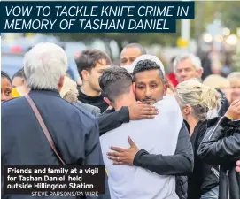  ??  ?? Friends and family at a vigil for Tashan Daniel held outside Hillingdon Station