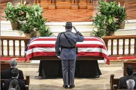  ?? JOHN AMIS / FOR ATLANTA JOURNAL-CONSTITUTI­ON ?? An honor guard salutes during Tuesday’s funeral for former Gov. and U.S. Sen. Zell Miller at Peachtree Road United Methodist Church.