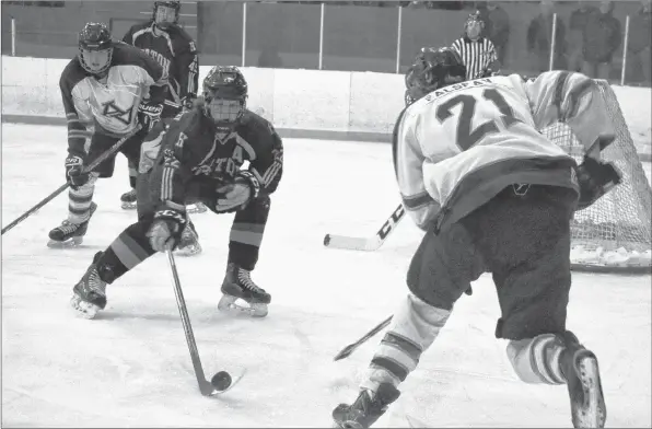  ?? CAROLE MORRIS-UNDERHILL ?? Ethan Salsman’s second period attempt on Horton’s net was thwarted by Dawson McPhail. During the Feb. 17 game, Salsman recorded one assist.