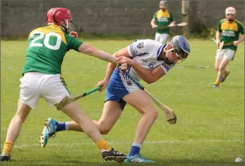  ??  ?? Conor Crean (HWH-Bunclody) and Ollie Doran (Craanford) are determined to win that elusive ball.