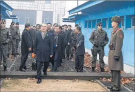  ?? South Korean Unificatio­n Ministry ?? HEAD of the South Korean delegation Lee Woo-sung, front, in Panmunjom, a diplomatic outpost in the demilitari­zed zone. Talks are to continue Wednesday.