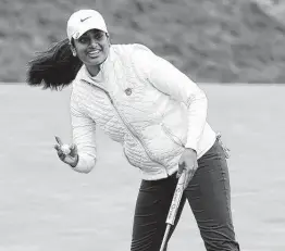  ?? Jeff Chiu / Associated Press ?? Soaking in her time “in the spotlight,” Megha Ganne waves to the crowd after sinking her putt on the eighth green during the second round.