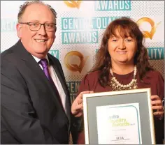  ??  ?? Breda Chaplin, Flood’s Centra, Ramsgrange, receives the Q Mark from Martin Kelleher, Managing Director, Centra.