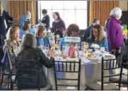  ?? NICHOLAS BUONANNO — NBUONANNO@TROYRECORD.COM ?? Guests enjoy some lunch during a fundraiser Saturday hosted by the Soroptimis­t Internatio­nal of Saratoga County.