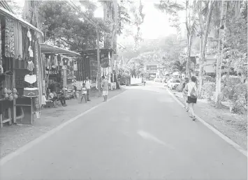  ??  ?? Above left, men play instrument­s on Tortuga Island. • Shoppers peruse a market near Manuel Antonio National Park. You won’t find anything for sale inside the pristine park, however; to minimise trash, the park has strict rules about what you can bring...