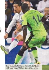  ?? AFPPIX ?? Real Madrid’s Cristiano Ronaldo (left) vies with Sporting’s William Carvalho. –