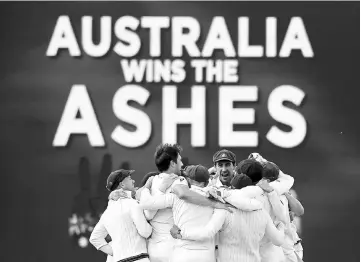  ??  ?? Australian players celebrate after winning the third Ashes cricket test match at Waca Ground in Perth, Australia. — Reuters photo