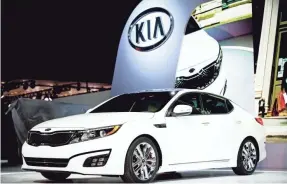  ?? JOHN MINCHILLO/AP FILE ?? Kia Optima hybrids from 2011 through 2013 are included in the recall.