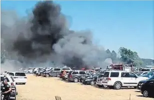  ??  ?? A Hamilton woman shot a video of the smoke rising above the field nearby the Niagara Lavender Festival Sunday.