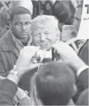  ?? SCOTT OLSON, GETTY IMAGES ?? Republican presidenti­al candidate Donald Trump greets people at a campaign event in Davenport, Iowa, on Saturday.