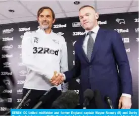  ??  ?? DERBY: DC United midfielder and former England captain Wayne Rooney (R) and Derby County’s Dutch manager Phillip Cocu shake hands during a press conference at Pride Park Stadium in Derby yesterday. — AFP
