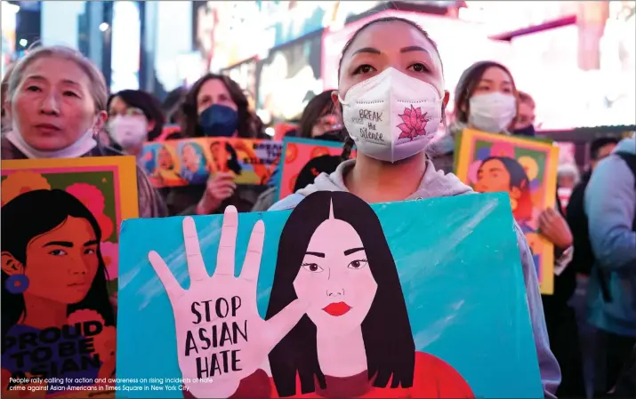  ?? People rally calling for action and awareness on rising incidents of hate crime against Asian-Americans in Times Square in New York City ??