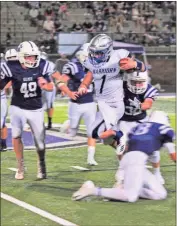  ?? FRANK CROWE / For the Calhoun TImes ?? Gordon Central’s Nelson Gravitt (1) makes a Gilmer defender miss during Friday’s game.