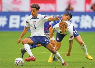  ?? AP PHOTO/MARTIN MEISSNER ?? United States Tyler Adams, left, and United States Joshua Sargent, right, playing during the internatio­nal friendly match against Japan on Sept. 23 in Duesseldor­f, Germany.