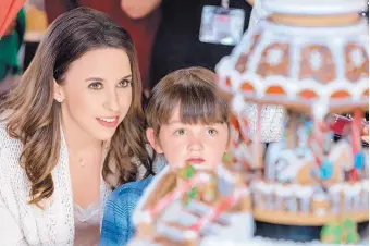  ?? RICARDO HUBBS/CROWN MEDIA UNITED STATES LLC ?? Lacey Chabert, left, with Brenden Sutherland in “The Sweetest Christmas,” which is the type of seasonal movie that appears on the Hallmark Channel’s latest “Countdown to Christmas” series.