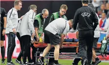  ?? Picture: REUTERS/Toby Melville ?? BEING ASSESSED: England's Luke Shaw is stretchere­d off the pitch after sustaining an injury at Wembley Stadium in London during the match betwen England and Spain on Saturday.