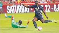  ?? AP ?? Romelu Lukaku scores past Real Salt Lake goalkeeper Lalo Fernandez during the first half of a friendly match Monday.