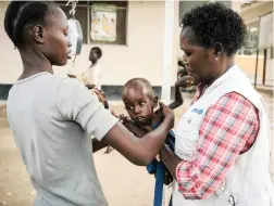  ?? PICTURE: AP ?? LIFE-SAVING: A mother, left, takes hold of her son after he was weighed at Al Sabbah Children’s Hospital in Juba, South Sudan. New technologi­es are being developed that could revolution­ise healthcare for the poor.