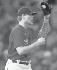  ?? CHARLES KRUPA/AP ?? Red Sox pitcher Tanner Houck reacts to a two-run home run by Rays Wander Franco on Oct. 11, 2021, in Boston.