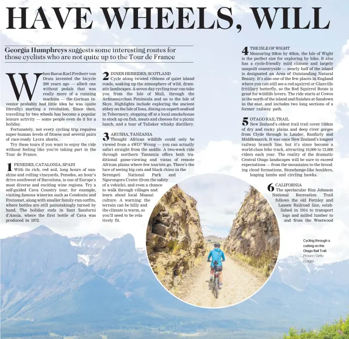  ?? Picture / Getty Images ?? Cycling through a cutting on the Otago Rail Trail.