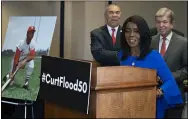  ?? ALEX BRANDON — THE ASSOCIATED PRESS ?? Rep. William Lacy Clay, D-Mo., left, and Sen. Roy Blunt, R-Mo., right, stand as Judy Pace Flood speaks during a news conference Feb. 27 in Washington.