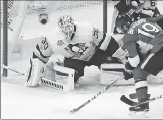  ?? ADRIAN WYLD, THE CANADIAN PRESS ?? Senators’ Derick Brassard looks to shoot on Pittsburgh Penguins goalie Matt Murray during the first period of game four of the Eastern Conference final in Ottawa on Friday.