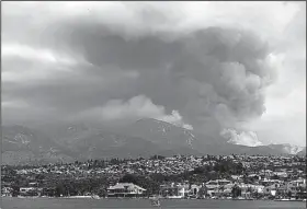  ?? AP/The Orange County Register/KEVIN SULLIVAN ?? Smoke rises Wednesday from a wildfire in the mountains near Mission Viejo, Calif. The blaze consumed mostly unoccupied land, but fire crews feared that it could threaten foothill communitie­s.