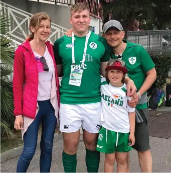  ??  ?? Kuba Wojtkowicz pictured with his proud parents and little brother Max at the U20 World Cup.