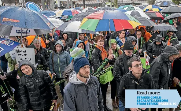  ?? MURRAY WILSON/STUFF ?? The umbrellas were up when primary school teachers rallied in The Square, Palmerston North, yesterday as part of a nationwide strike.