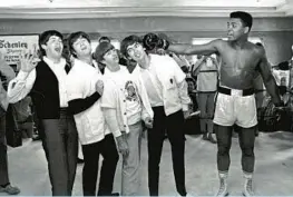  ?? ?? Among the Beatles’ encounters in Florida was time with Muhammad Ali, known at the time as Cassius Clay. The group visited his training camp in Miami Beach on Feb. 17, 1964.