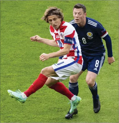  ?? ?? Croatia’s Luka Modric squares up to Callum McGregor of Scotland during the Euros at Hampden this year