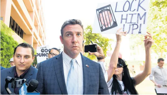  ?? AP ?? US Representa­tive Duncan Hunter, R-California, leaves federal court after a hearing in San Diego.