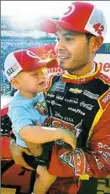  ?? Jonathan Ferrey/Getty Images ?? Kyle Larson celebrates his win on Father’s Day with his son, Owen.