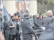  ?? STEPHEN B. MORTON — THE ASSOCIATED PRESS ?? Black Lives Matter and Black Panther protesters gather outside the Glynn County Courthouse where the trial of Travis McMichael, his father, Gregory McMichael, and William “Roddie” Bryan is held, Monday in Brunswick, Ga.