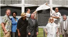  ?? Brett Coomer / Houston Chronicle ?? A Texas State Historical Marker for the Astrodome is unveiled by Mike Vance and Mike Acosta during a ceremony on Tuesday.