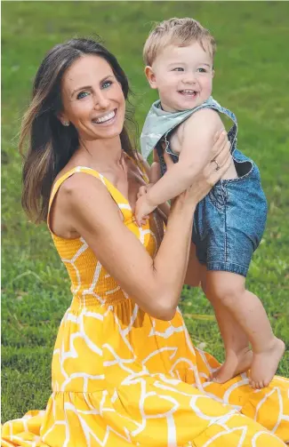  ?? ?? Amanda Abate with her 14-month-old son Bobby in her local park. The Seven News Gold Coast anchor is pregnant with her second child. Picture: Glenn Hampson