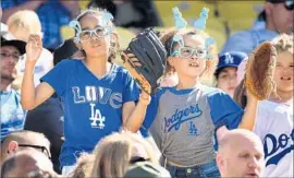  ?? Wally Skalij Los Angeles Times ?? ATTENDANCE at Dodger Stadium remains strong, but away from the ballpark, competitio­n for young fans’ attention is fierce in the digital age.