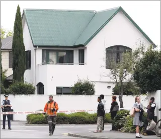  ?? Tessa Burrows/ AFP/Getty Images ?? Police cordon off the area in front of the Masjid al Noor mosque after a shooting incident in Christchur­ch, New Zealand, on Friday.