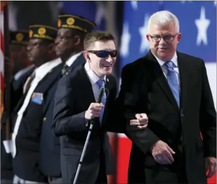  ?? THE ASSOCIATED PRESS ?? Timmy Kelly leaves the stage after singing the National Anthem during the second day of the Democratic National Convention in Philadelph­ia Tuesday.