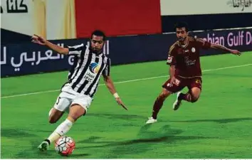  ?? Abdul Rahman/Gulf News Archive ?? Musallem Fayez of Al Jazira (left) and Mohammad Al Menhali of Al Wahda in action during their AGL match in Abu Dhabi. The two teams meet at the Al Nahyan Stadium today.