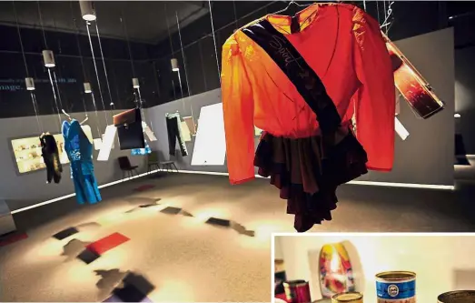  ?? AFP ?? Untold tales: Children's choir uniform being displayed at Sarajevo's newly opened War Childhood Museum. (Inset) Empty cans of foods and beverages from various foreign humanitari­an aid shipments at the museum.—