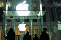  ?? – AFP/Files ?? DATA SECURITY AT STAKE: This file photo taken on February 17, 2016 shows people walking outside the Apple store on the Fifth Avenue in New York